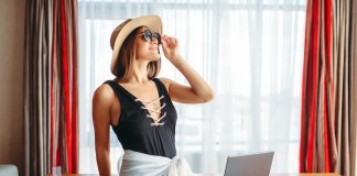 Woman sitting on table, thinking about adventure