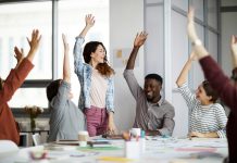 Contemporary Business People Raising Hands