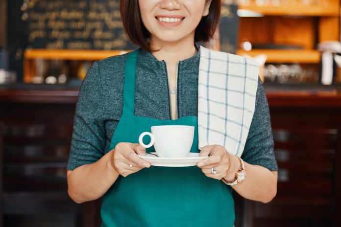 Waitress with coffee cup Waitress with coffee cup