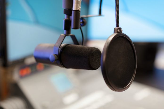 Microphone in modern radio station broadcasting studio