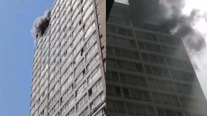 Incendio en edificio del centro de Santiago afecta pisos superiores. Emergencia en curso. Incendio en edificio del centro de Santiago afecta pisos superiores. Emergencia en curso.